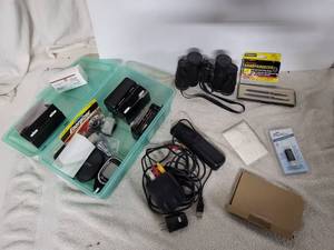 lot 261 image: Hearing aid batteries, staples, binoculars, memory sticks and more