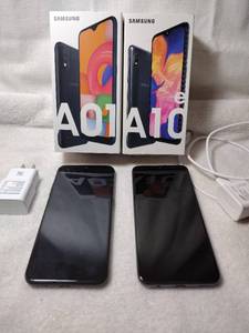 lot 87 image: (2) Samsung Phones with chargers and box - (1) A01 (1) A10e, needs factory reset