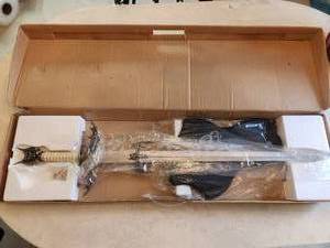 lot 13 image: Bat themed long sword in box - with display