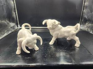 lot 27 image: Pair of bull figurines