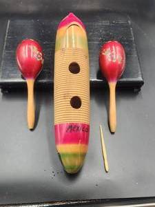lot 85 image: Selection of wooden musical instruments Guiri and maracas