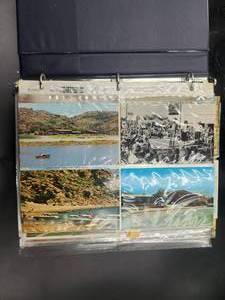 lot 235 image: Binder full of vintage postcards, some have been mailed - vintage stamps