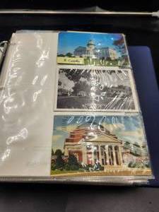 lot 237 image: Binder full of vintage postcards, some have been mailed - vintage stamps