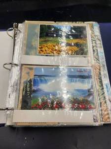 lot 244 image: Binder full of vintage postcards, some have been mailed - vintage stamps
