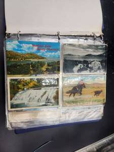 lot 238 image: Binder full of vintage postcards, some have been mailed - vintage stamps