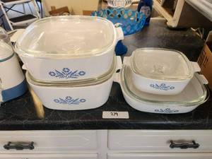lot 279 image: 4 pieces of Corning ware - 2 4 qt with lids, 1 12 qt with lid, and 9 12 with lid