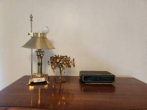 lot 352 image: Items on top of dresser - Electric replica of gas lamp, gold leaf dream tree, and alarm clock
