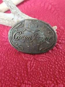 lot 23 image: Vintage Crown Royal brass belt buckle