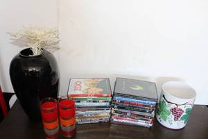lot 45 image: Black Vase, Vintage Tea Glasses, Raised Grape Styled Container, and Selection of DVDs as pictured