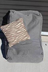 lot 64 image: Bean Bag in the shape of a chair and throw pillow
