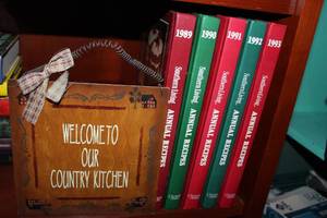 lot 98 image: Vintage Southern Living Annual Recipes 1989-1993 and Wall Plaque