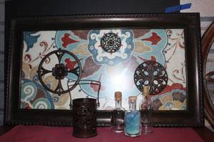 lot 117 image: Large Interesting Framed Art Pictured, Hanging Candle Lantern, Colored Sand Bottle and 2 empty Bottles.