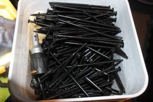 lot 126 image: Bucket of 6.5 inch Screws and Dewalt Drywall Screw Gun Replacement Nose Cone Pictured As Shown