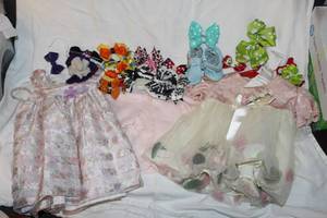 lot 144 image: Girls Dresses, Sweater and lots of hair bows