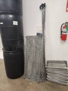 lot 99 image: Wire rack with 3 casters-missing one - 18x48 - has 6 shelves.