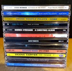lot 103 image: ONE DOZEN MUSIC CDs FEATURING TOP BANDS AND ARTISTS