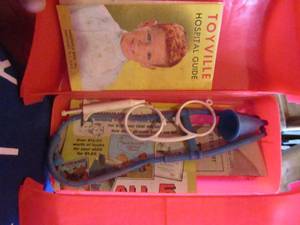 lot 15 image: Vintage red plastic dry bag, comes with original paper work and a few items inside
