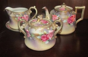 lot 20 image: Hand painted Nippon China, mini tea pot, creamer and sugar set  qty 3 pieces