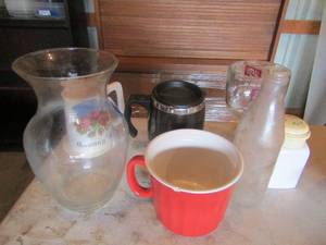 lot 25 image: 1894 vintage coke bottle, Granny B Texas made coffee cup, flower vase, various other cups and more