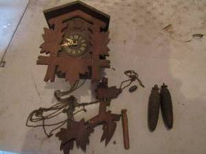lot 45 image: 107 Vintage wooden coocoo clock with weights, needs lots of repairs, all pieces included to repair