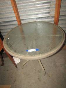 lot 54 image: Oval glass top outdoor patio table, 2529