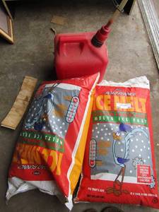 lot 53 image: Road runner ice melt qty 2 new bags 1 has a small hole in it