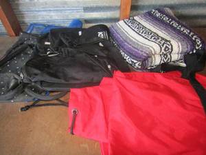 lot 62 image: Various bags like Marlboro bag, and black bags, plus a small throw blanket