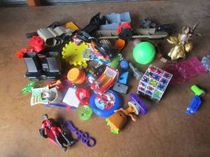 lot 87 image: Misc. lot of kids toys includes, rubix cube, ball, goggles batman and more