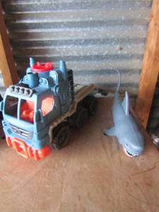 lot 89 image: Mattel toy hauler truck, Shark that bites if you push the tail