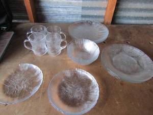lot 125 image: Set of clear glass dishes with floral designs 4 coffee cups, 4 dinner plates, 4 saucers, 4 dessert plates, and 4 bowls