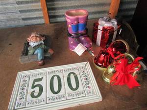 lot 130 image: Purple pair of boots sentcey warmer address number 500 sign, covered glass telfloral gift box dcor, and some plastic bells and a garden nome wall sign