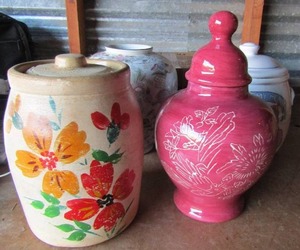 lot 12 image: 10 in cookie o my heart covered cookie jar, covered flour jar, a floral dcor vase 10 , and a maroon covered jar