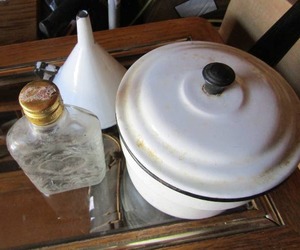 lot 152 image: Covered enamel cook ware pan with lid, funnel- 12 pint glass bottle with heart design and lid