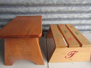 lot 187 image: 9913 wooden foot stool, 6128 wooden lettered foor stool with letter T printed all over it.