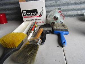 lot 200 image: Various cans of used paints white in color, new and used roller ends and paint brushes, paint brands are Monarch-- home depot