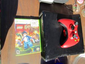 lot 26 image: X-box 360 console with no power cord, 1 remote, 1 harry potter game used condition