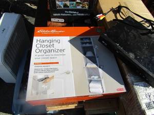 lot 30 image: New camera roll game never used, DVD video player, Eddie Bower hanging closet organizer NIB