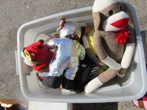 lot 32 image: Grey tote full of various stuffed animals for babies and or kids