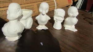 lot 48 image: Ceramic duck family qty 4, needs painted if you choose
