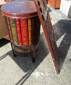 lot 67 image: 3916 wall art of book design very nice, has a matching oval book design table with 1 opening on side very nice, 2715 diameter    x $$
