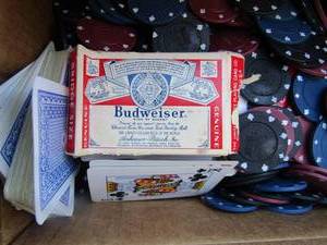 lot 193 image: small box of cards used and poker chips blue black red unsure if all is there