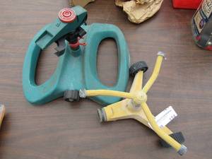lot 124 image: 2 yard water sprinklers, by Gilmour plastic and 1 is metal