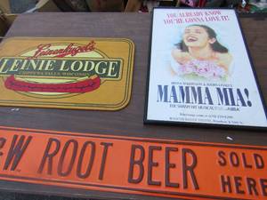 lot 175 image: 2214 Mamma Mia framed art, 1322 wooden wall art of Lainie Lodge in Chippewa falls, Wisconsin, 636 metal wall art of A&W root beer sold here