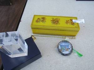 lot 176 image: Walt Disney world metal drink coasters qty 4, Candle snuffer, Glass sculpture of wind men of the world in blue case, Yellow Angel dcor jewelry box