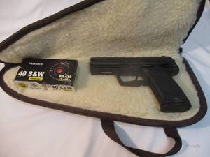 lot 1 image: HK USP, 40 S&W SEMI AUTO PISTOL WITH 12-ROUND MAG, SOFT GUN CASE AND BOX OF 43-RDS. OF MONARCH AMMO