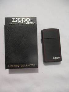 lot 13 image: Zippo Border Model 1618ZB, Slim Red BorderMatte Black, Unused,Like New In Box