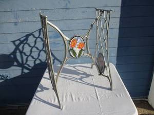 lot 9 image: Aluminum Table  Sewing machine Stand With double sided Floral Design Plaque on Middle and Ends, About 20 x 18 x 27-H
