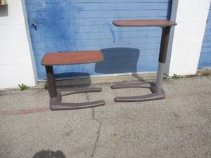 lot 14 image: 2-Matching Stryker #E-2012, Under Bed T.V. Trays On Casters, Adjustable height from 27 To 44 H. NOTE 2 X Money.