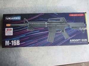 lot 42 image: NIB- UKARMS- Spring Powered, M-16B Air Soft Rifle With Magazine And Red Dot Laser Sight