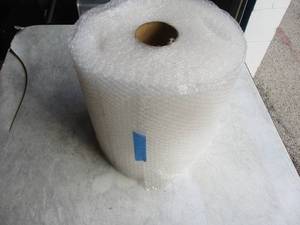 lot 44 image: 12-Dia. Roll Of 12 x 12 Break away sheets Of Small Bubble, Bubble Wrap, Packing Material
